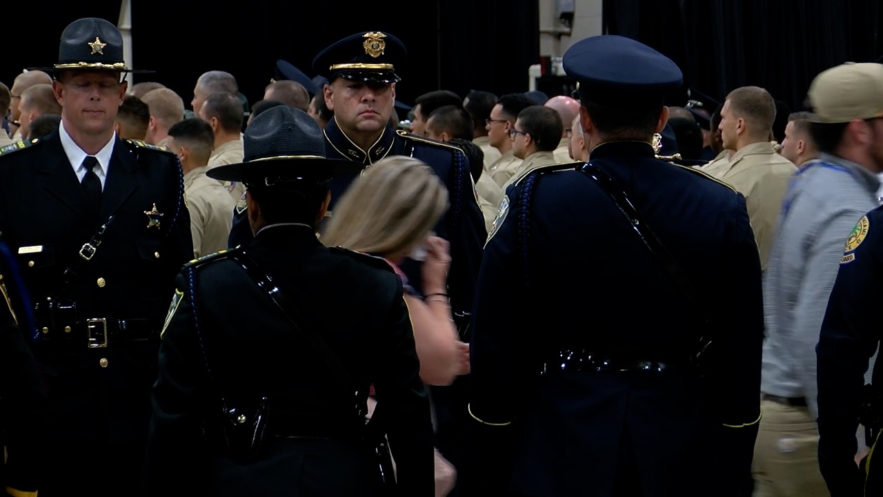 Families departing with a police escort
