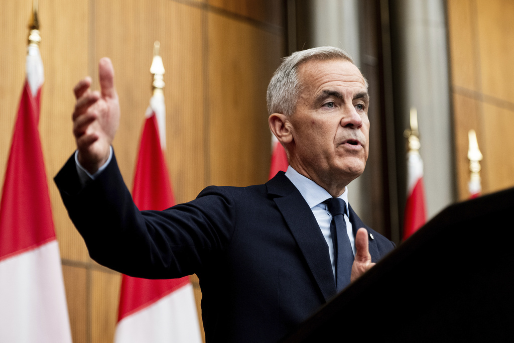 Prime Minister Mark Carney speaks during a news conference at the National Press Theatre in Ottawa on Friday, Aug. 22, 2025. 