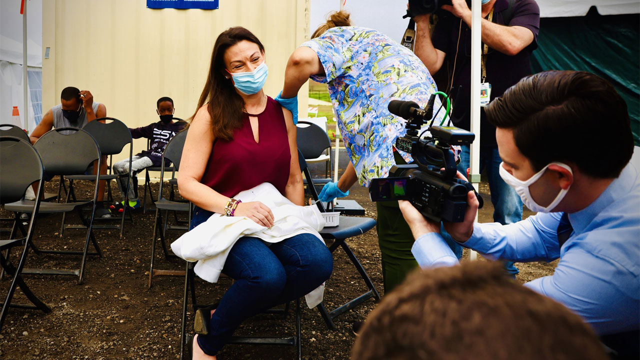 Florida Agriculture Commissioner Nikki Fried receives a COVID-19 booster shot on Dec. 29, 2021