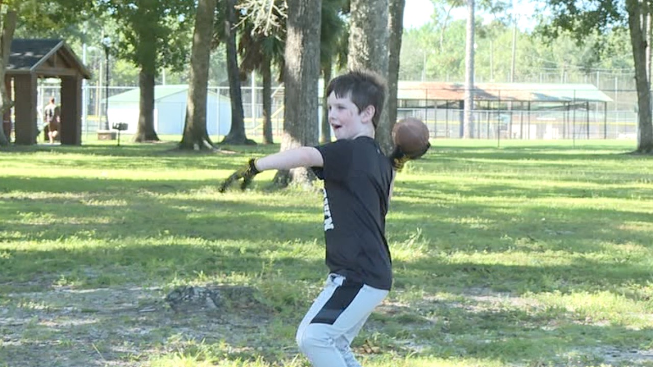 Sawyer Crawley playing with a football