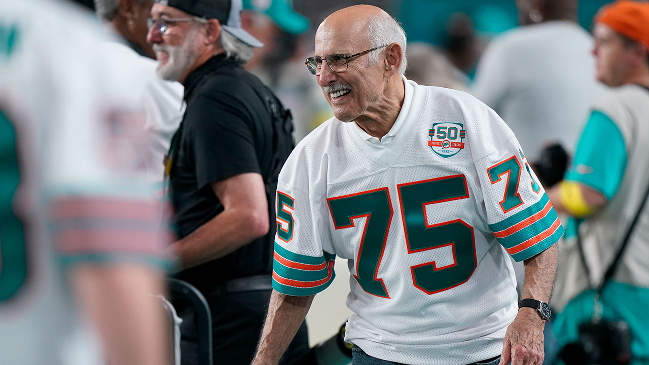 Manny Fernandez, a player in the Miami Dolphins 1972 undefeated team smiles during a half time celebration during an NFL football game against the Pittsburgh Steelers, Sunday, Oct. 23, 2022, in Miami Gardens, Fla. (AP Photo/Wilfredo Lee )