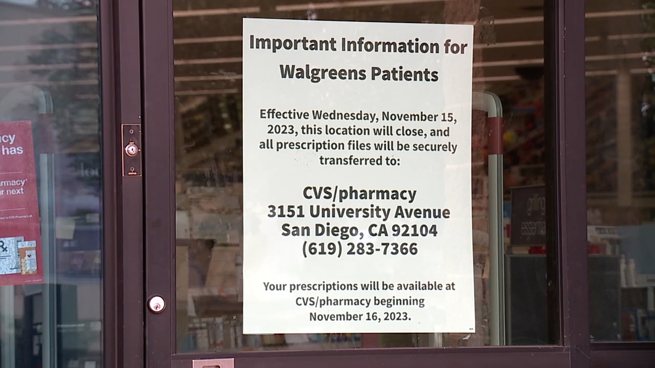 Signs on the door alert customers the Walgreens on University Avenue is closed.