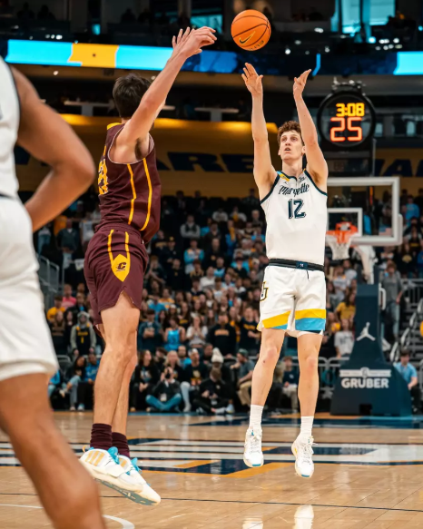 Marquette senior forward Ben Gold rises for a jump shot against a Central Michigan defender on Saturday, Nov. 22, 2025, at the Fiserv Forum in Milwaukee.