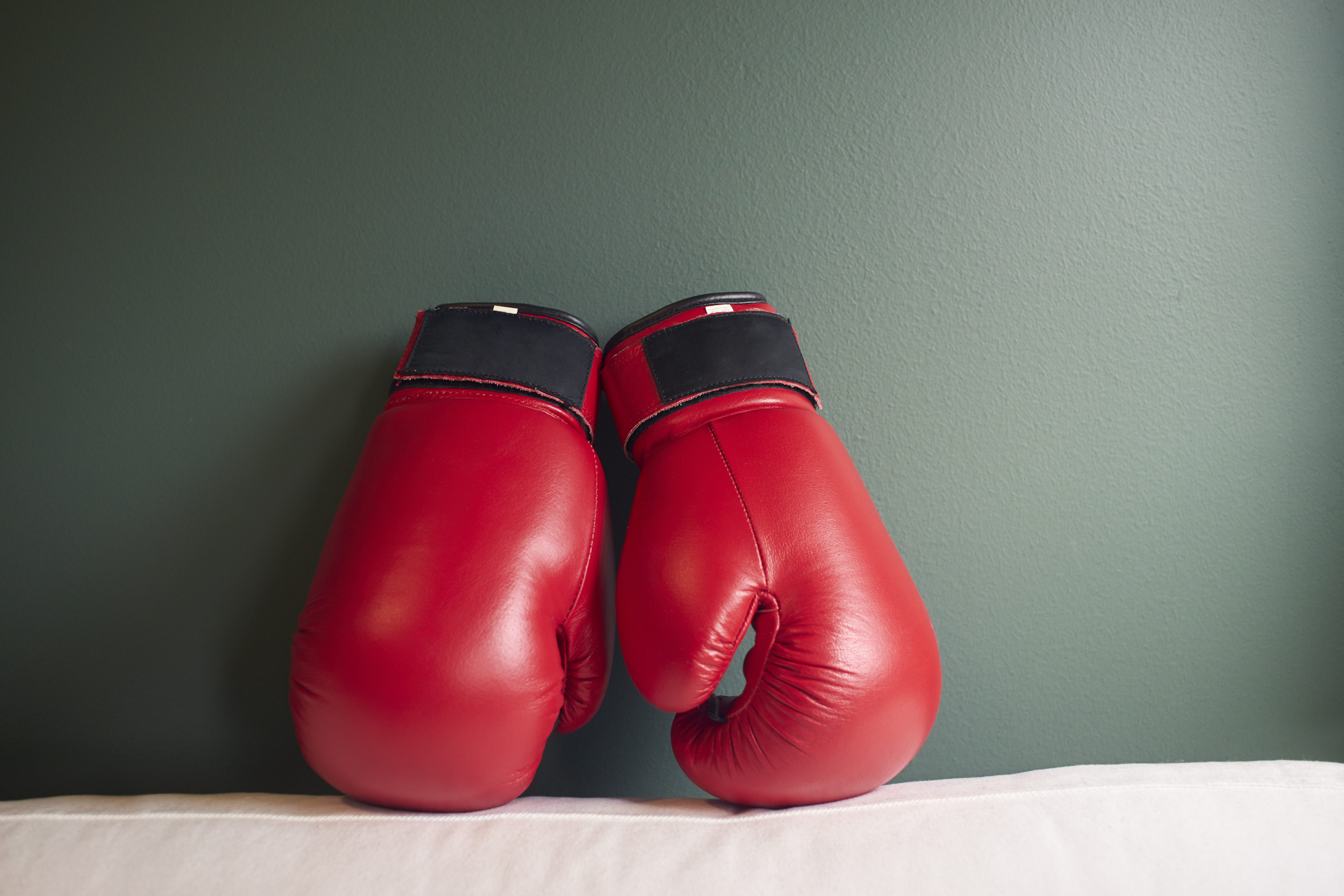 graphicstock-boxing-gloves-on-a-green-background_rOugFowgog-SBI-301984847.jpg