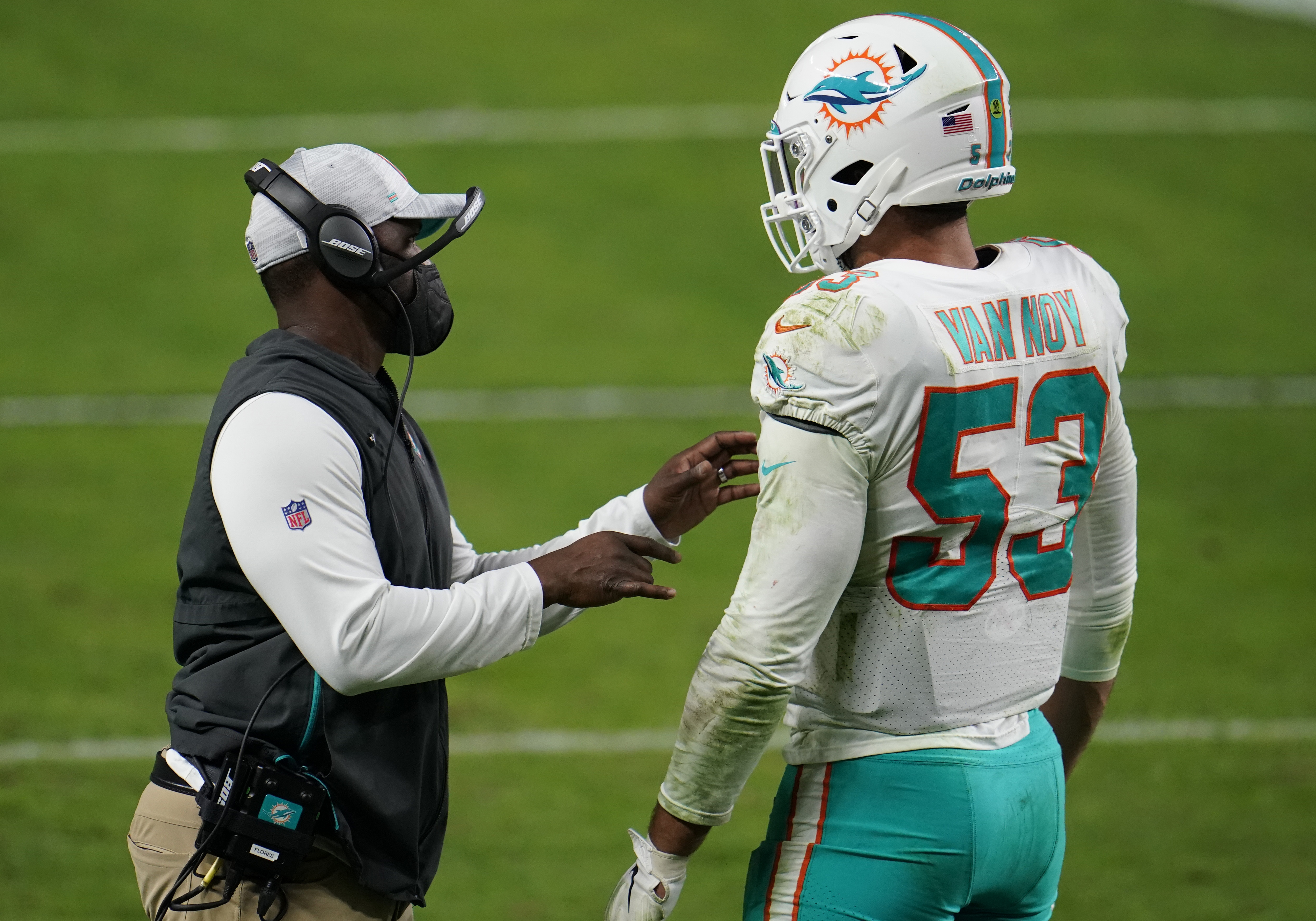 Miami Dolphins head coach Brian Flores speaks to linebacker Kyle Van Noy in December 2020