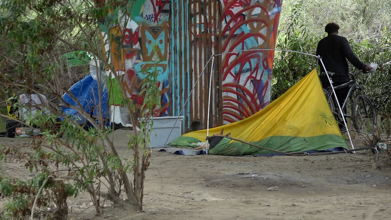 People live in tents along the San Diego River in Mission Valley