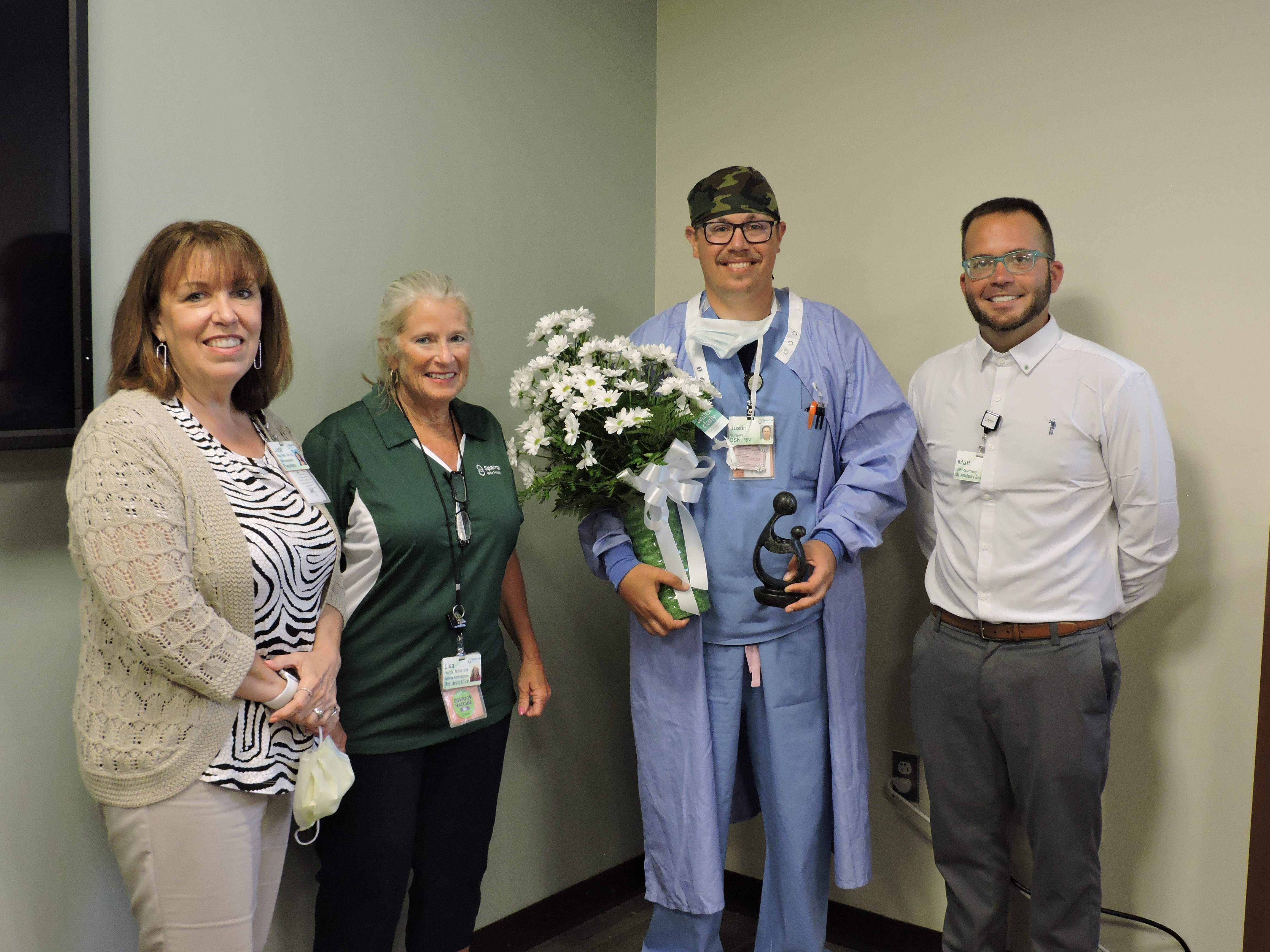 Sparrow Ionia Hospital Nurse Justin Thomas displays his DAISY award for extraordinary nursing after a recent ceremony.