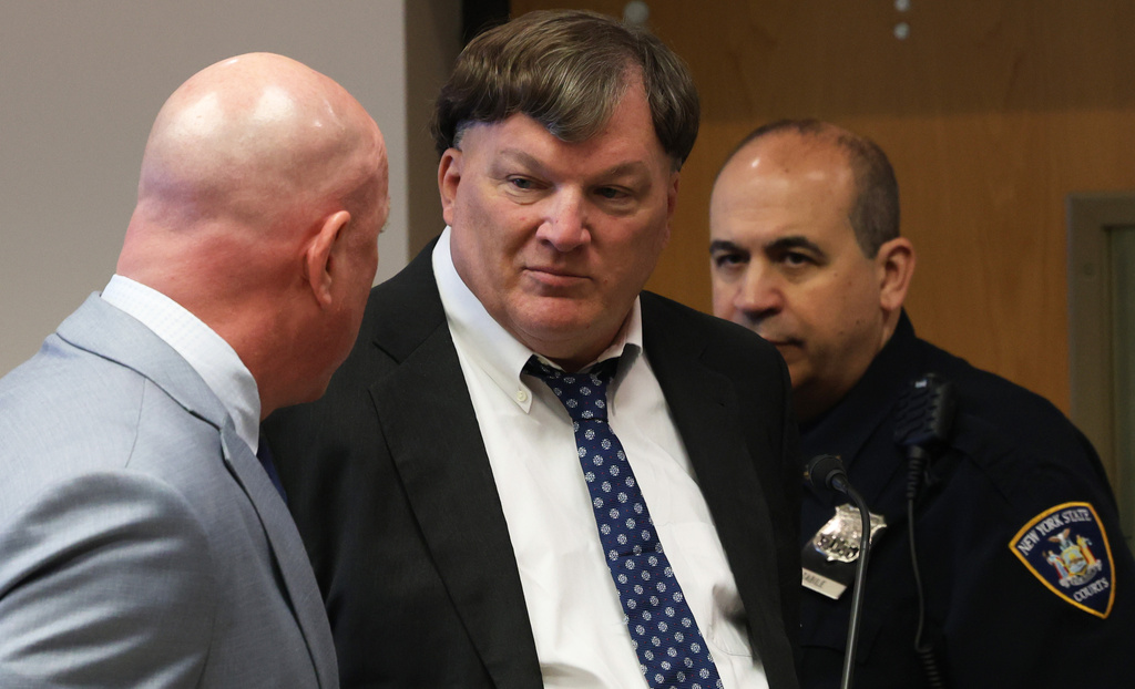 Rex A. Heuermann, center,  pleads guilty to murdering seven women and admitted he killed an eighth in a string of long-unsolved crimes known as the Gilgo Beach killings, at a court hearing in Suffolk County Court in Riverhead, N.Y., Wednesday, April 8, 2026. 