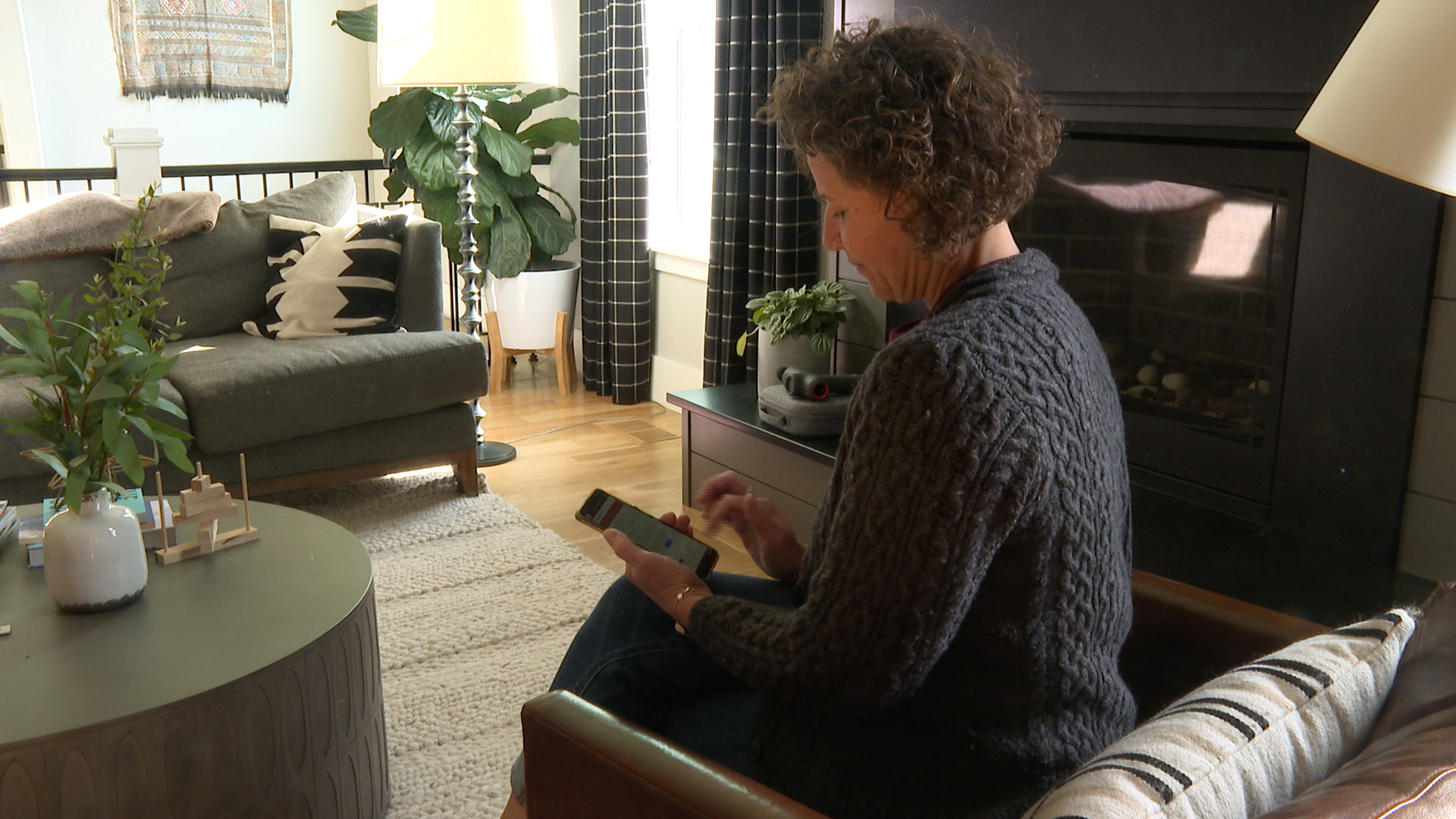 D38 mom, Pam Cooley, checks her phone for snow day notifications 
