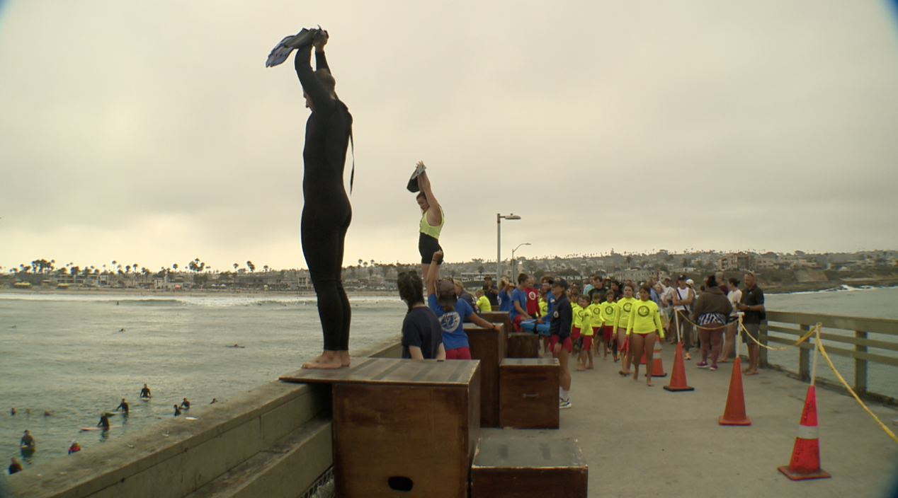 Junior Lifeguards jump off Ocean Beach Pier