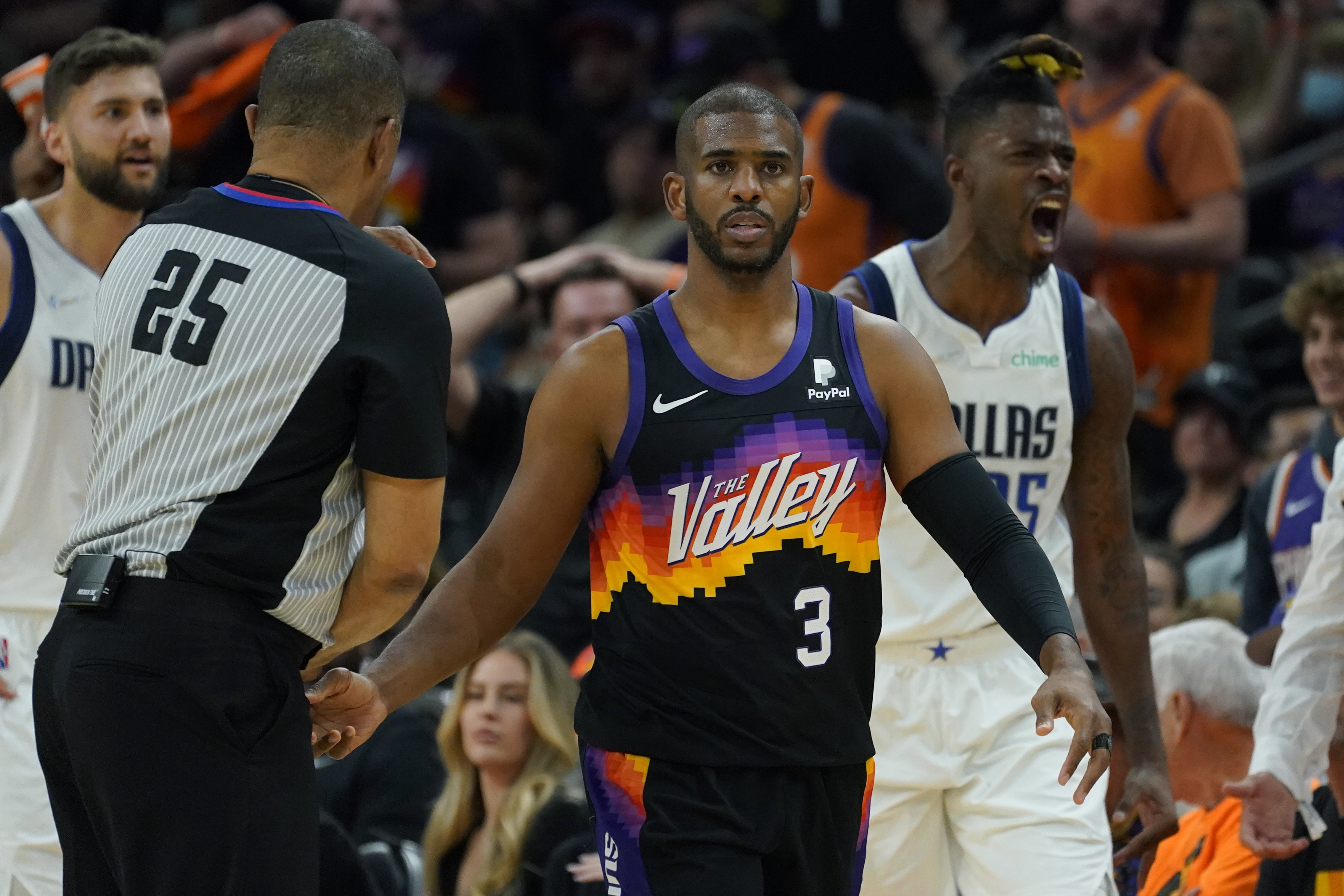Phoenix Suns guard Chris Paul (3) and Dallas Mavericks forward Reggie Bullock, right, react after Paul was called for a foul during the first half of Game 2 of an NBA basketball second round playoff series, Wednesday, May 4, 2022, in Phoenix. (AP Photo/Matt York)

