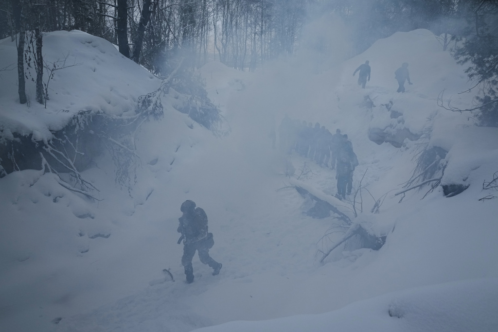 Participants of the tactical and medical courses run by the 3rd Assault Brigade demonstrate their skills in a final exam for civilians in Kyiv regional center for preparing the population for national resistance, Ukraine, Sunday, Feb. 8, 2026.