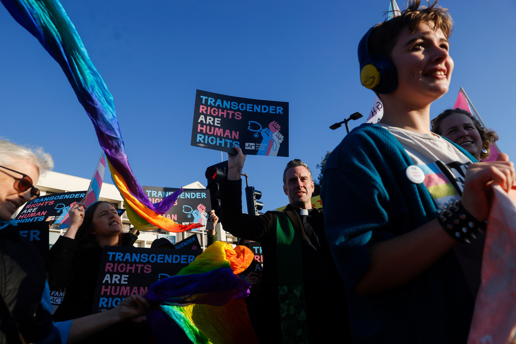 Members of Rainbow Families Action march from Bay Street in Emeryville, Calif., Monday, Dec. 8, 2025 to the Sutter corporate offices on Powell Street to protest the end of gender-affirming care to patients under age 19. 
