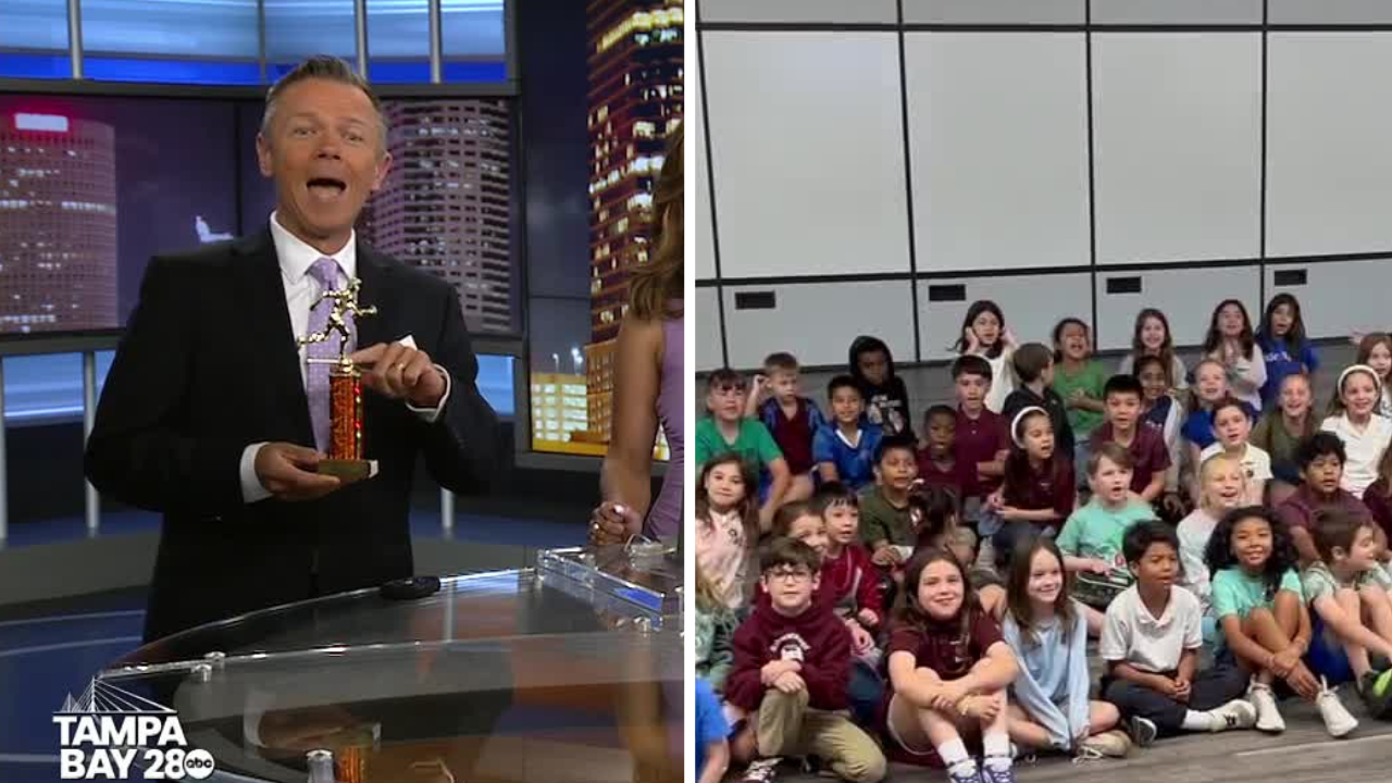 Meteorologist Greg Dee shows off his trophy from Schwarzkopf Elementary School