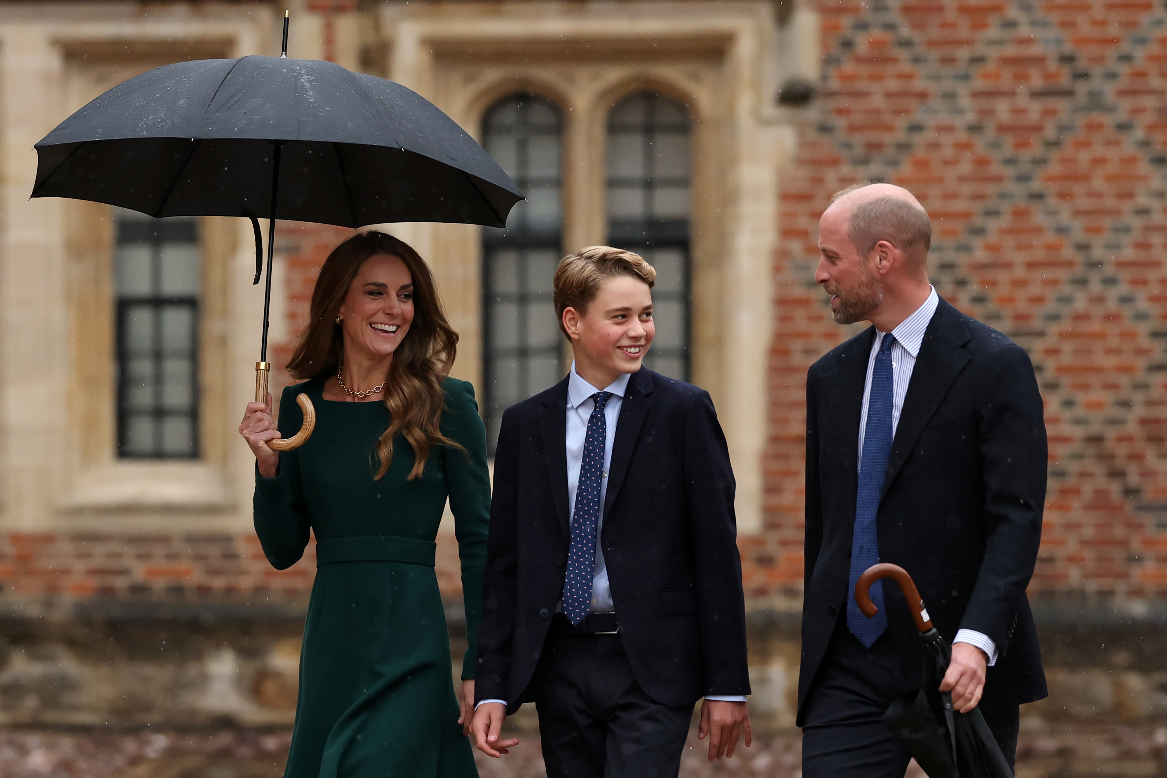 Britain's Kate, Princess of Wales, left, and Britain's Prince William walk with their 13-year-old son, Britain's Prince George, as he arrives for his first day at Eton College, in Eton, west of London, Tuesday, Sept. 8, 2026. 