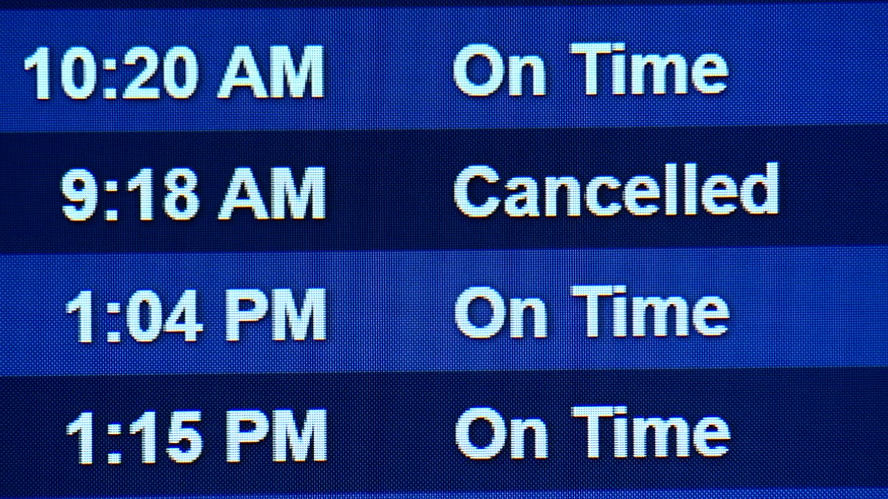 A cancelled flight on the information board at RSW.