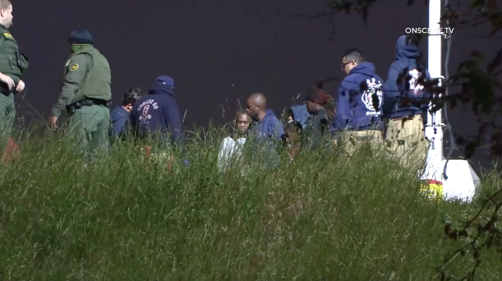 stringer photo of border patrol stopping migrants 4-28-23