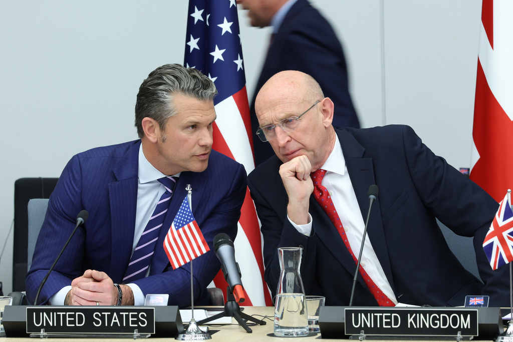 United States Defense Secretary Pete Hegseth, left, speaks with Britain's Defense Secretary John Healey during a meeting of the Ukraine Defense Contact Group at NATO headquarters in Brussels.