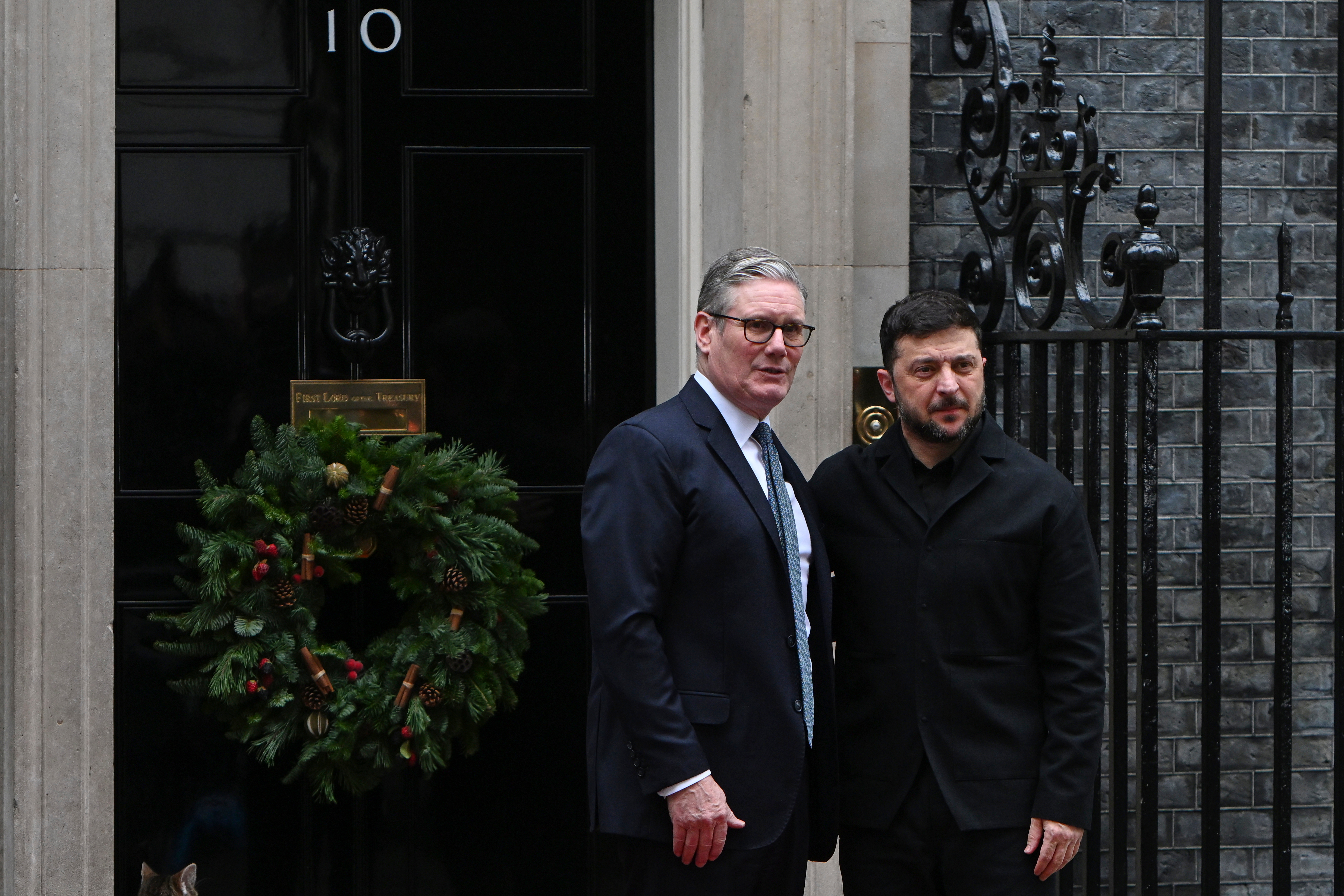 Britain's Prime Minister Keir Starmer greets Ukrainian President Volodymyr Zelenskyy, on the doorstep of 10 Downing Street, London, Monday, Dec. 8, 2025. 