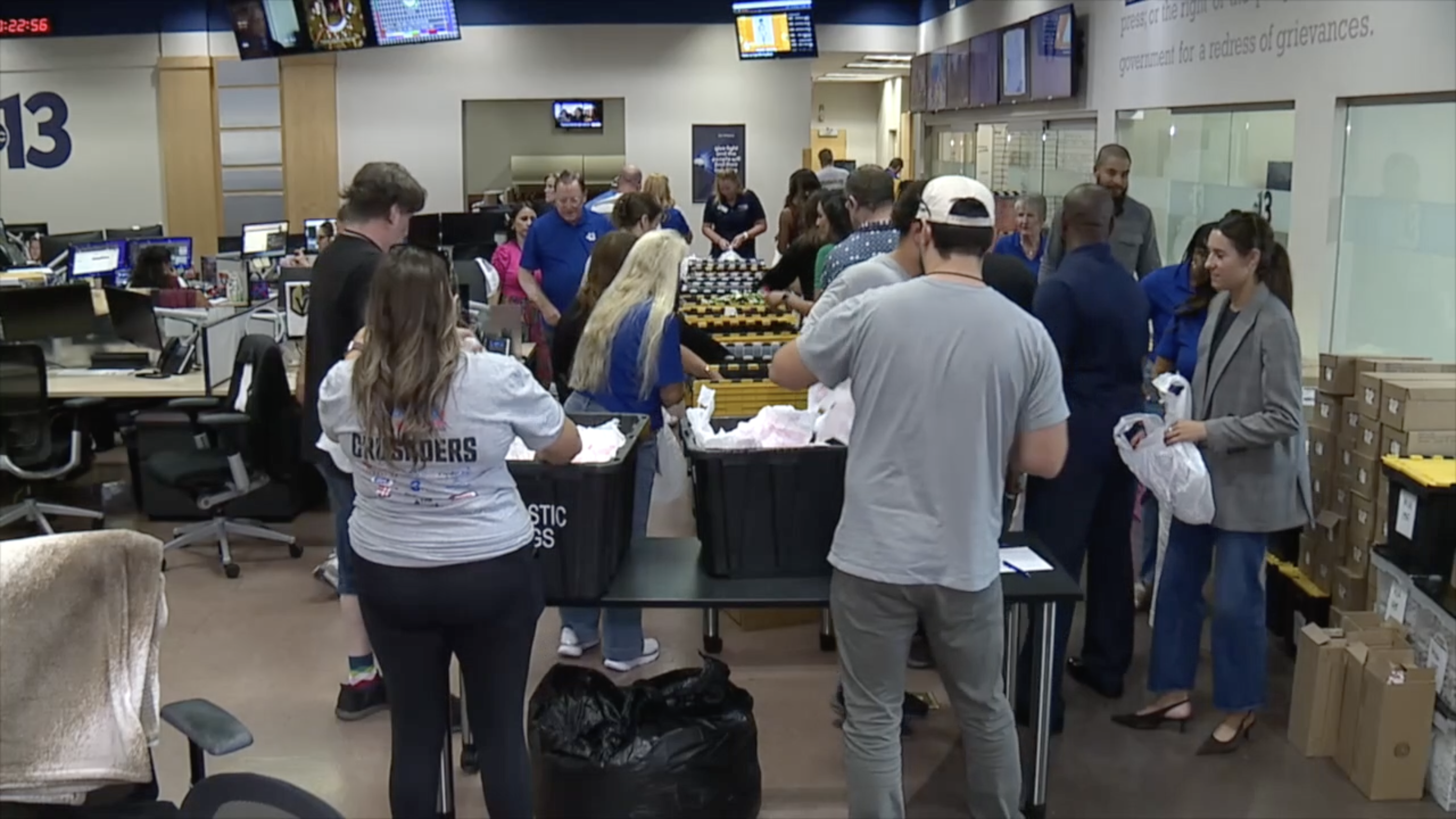 Channel 13 helps pack weekend lunches with Serving Our Kids Foundation