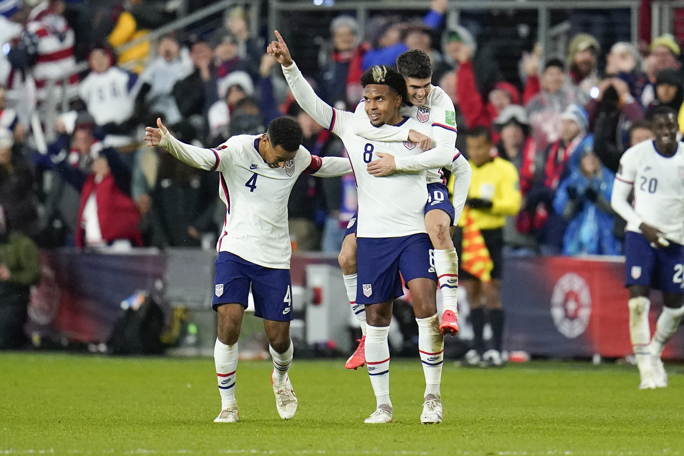 FILE - United States' Weston McKennie celebrates his goal with Tyler Adams, left, and Christian Pulisic during the second half of a FIFA World Cup qualifying soccer match against Mexico, Friday, Nov. 12, 2021, in Cincinnati. The U.S. won 2-0. Having revived their careers in Italy, AC Milan's Christian Pulisic and Juventus' Weston McKennie are looking forward to facing each other later this month in Serie A before joining the U.S. national team for the Copa América. 