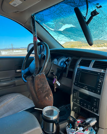 Shovel thru windshield.png