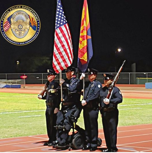 Paralyzed Peoria Officer Bill Weigt stands for National Anthem 
