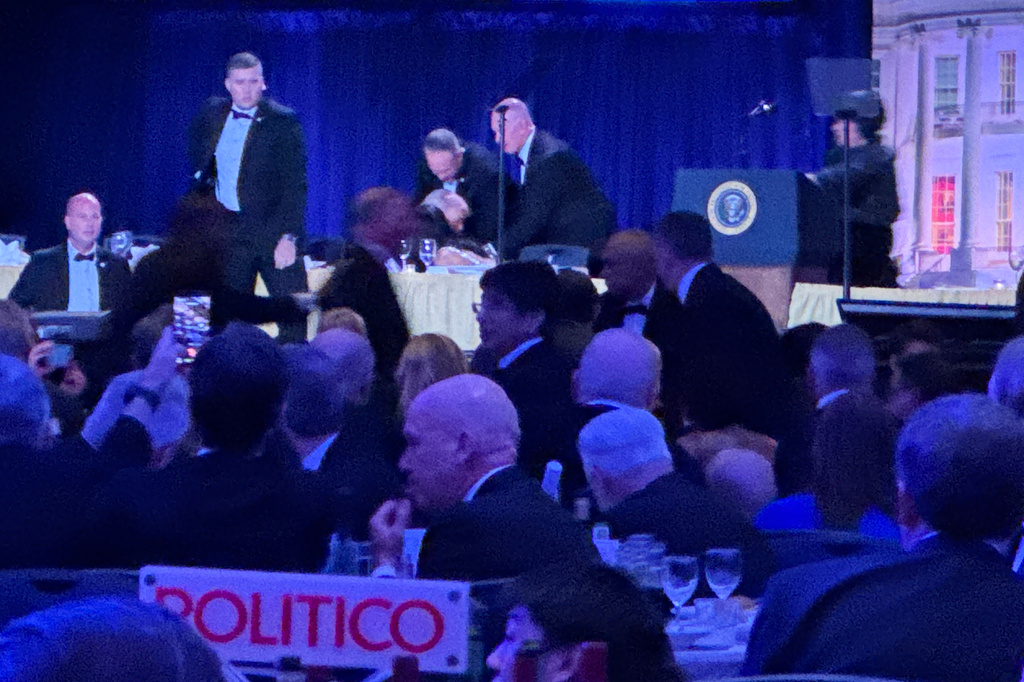 Secret service agents respond during the White House Correspondents Dinner, Saturday, April 25, 2026, in Washington.