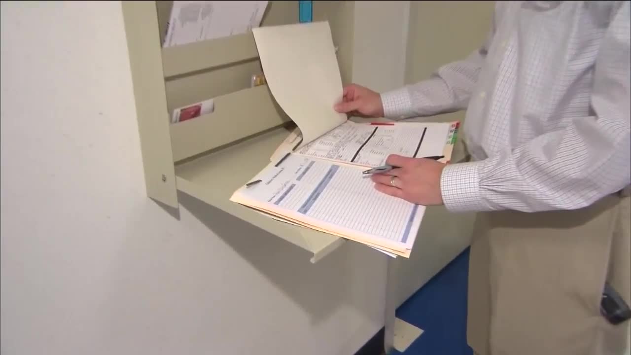 Medical person reading docs