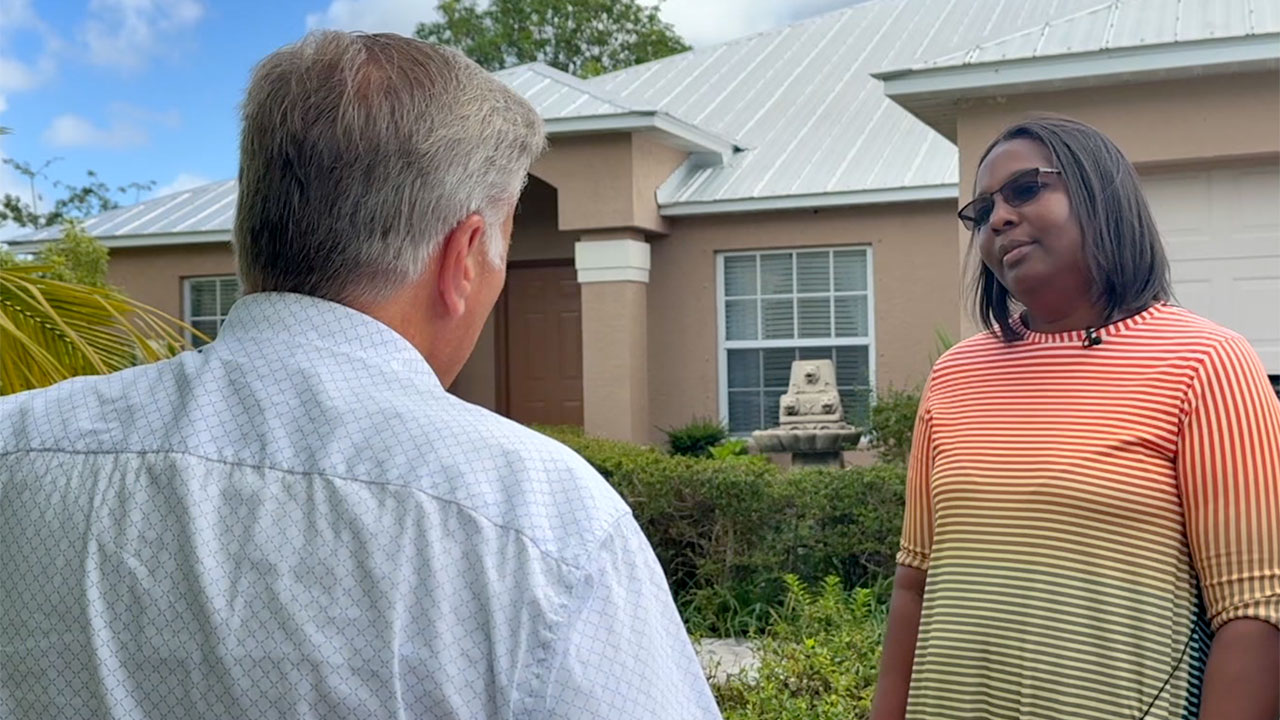 Port St. Lucie resident Verna Jackson speaks to WPTV reporter Matt Sczesny after the cost of home insurance.