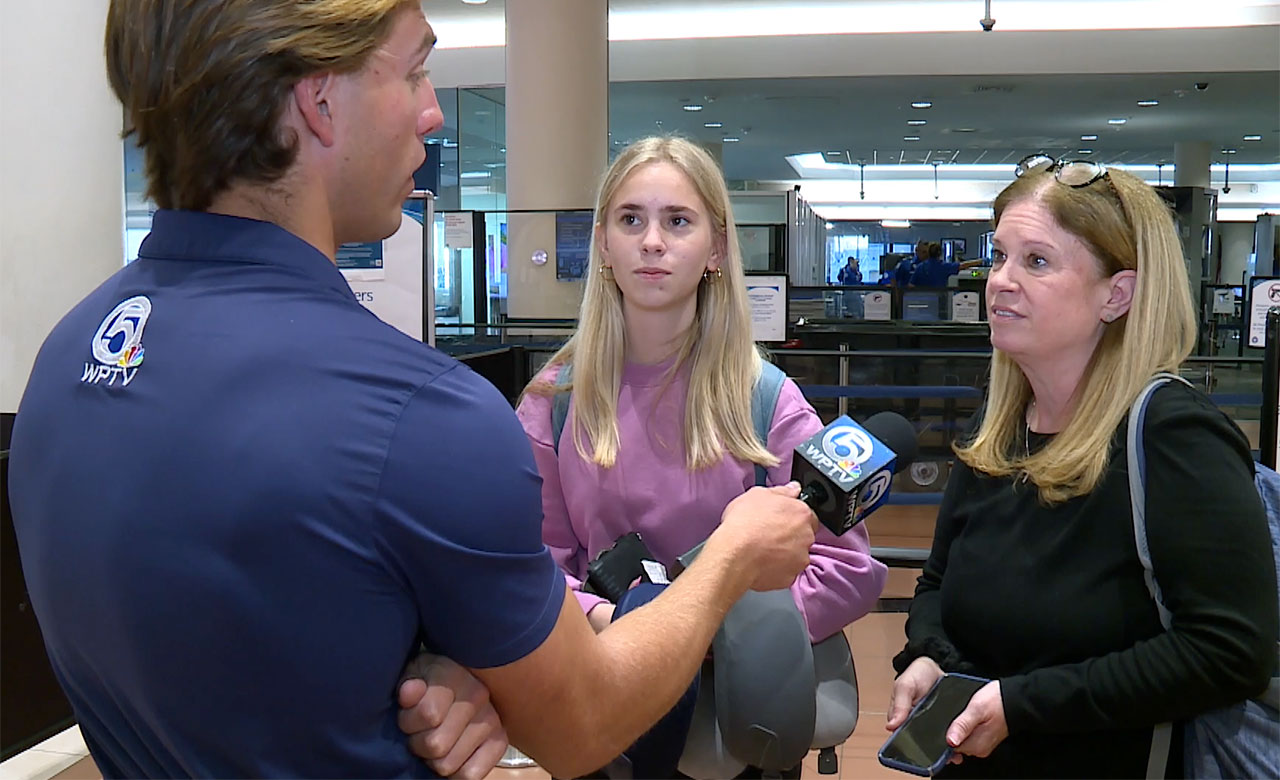 Travelers at PBIA speak to WPTV reporter Tyler Hatfield on Jan. 23, 2026.