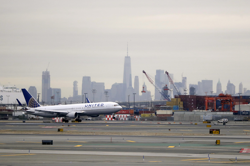 A United Airlines jet prepares touches down at Newark Liberty International Airport.