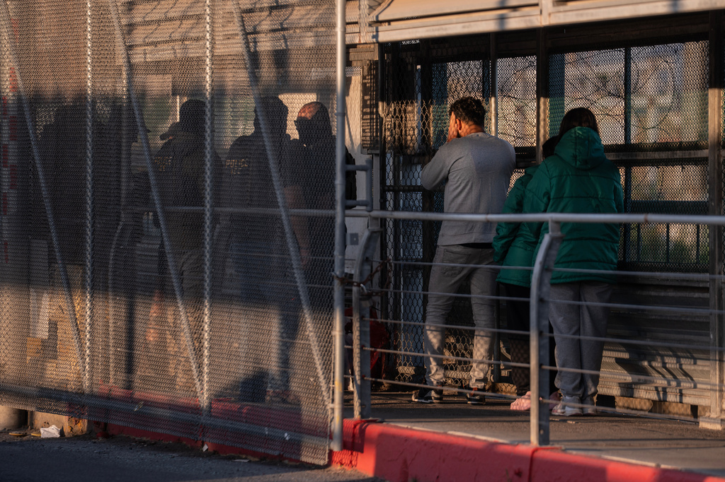 A group of undocumented migrants is deported by U.S. Immigration and Customs Enforcement agents across the McAllenHidalgoReynosa International Bridge in McAllen, Texas, March 13, 2026. 