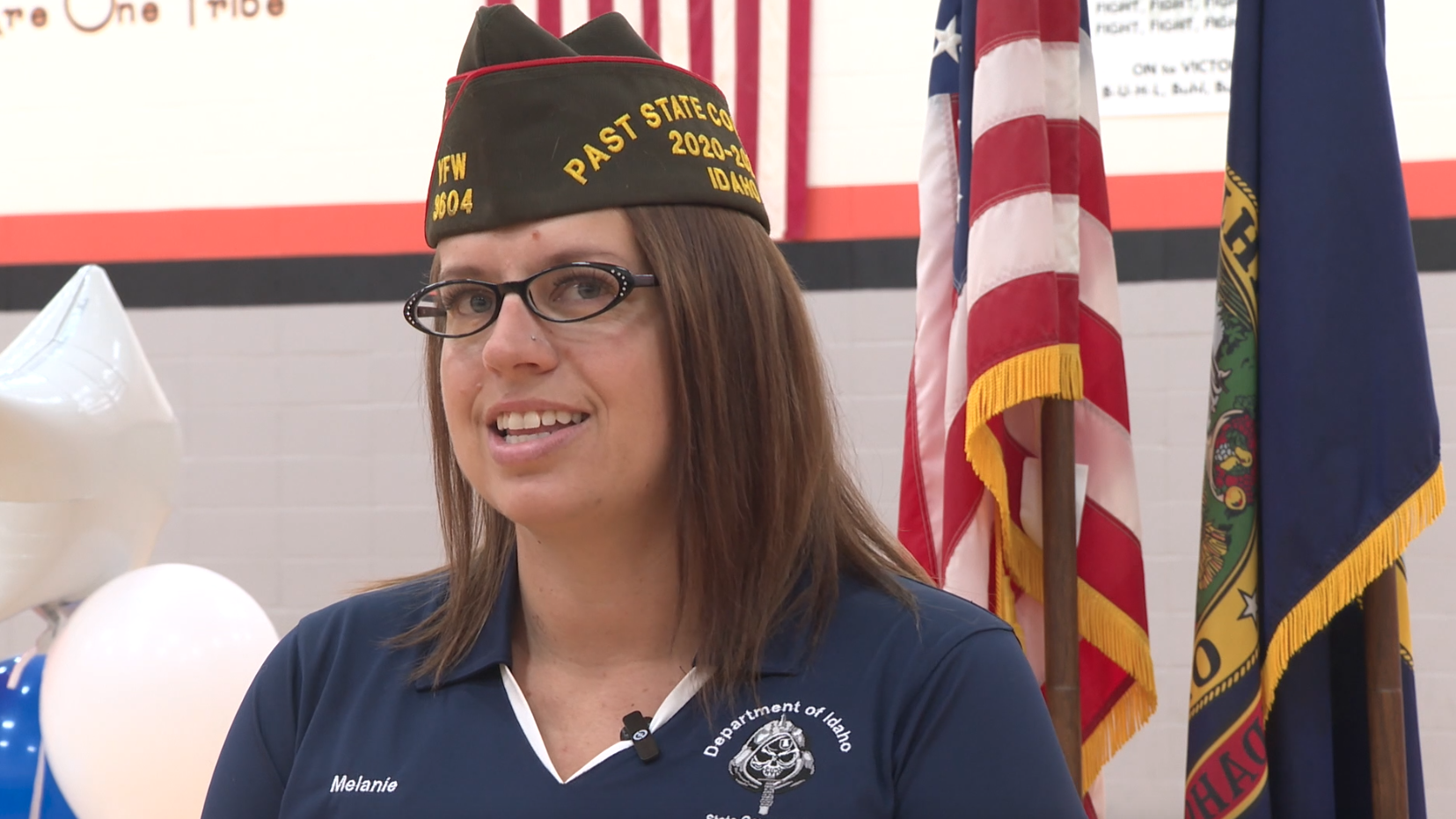 Veteran Melanie Rediker speaks on Friday, Nov. 8, 2024, in the gymnasium of Buhl Middle School 