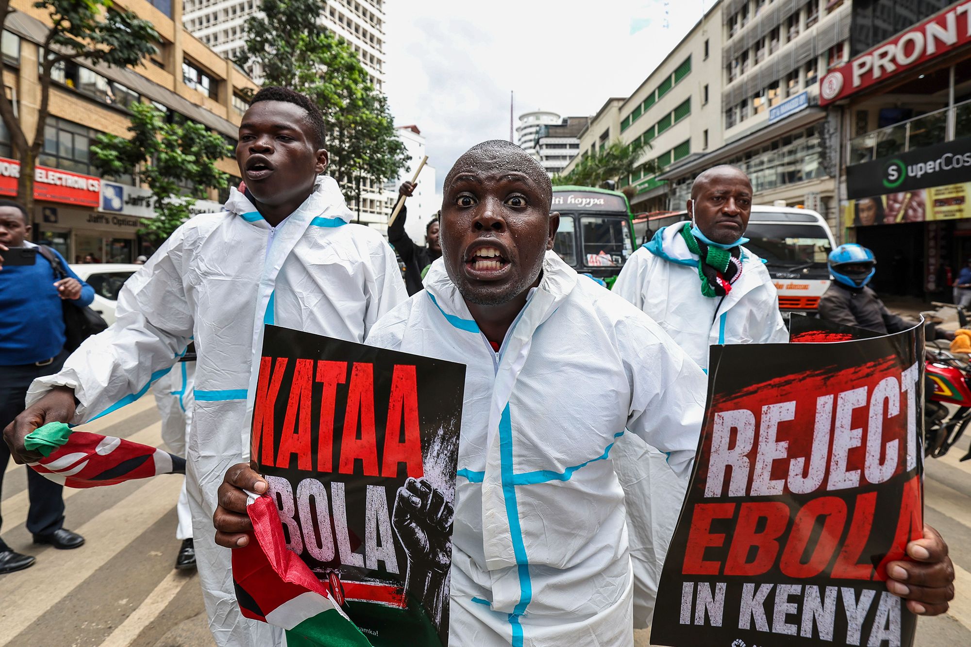 Activists shout slogans and hold placards during a protest against an Ebola quarantine facility, in Nairobi on June 2.