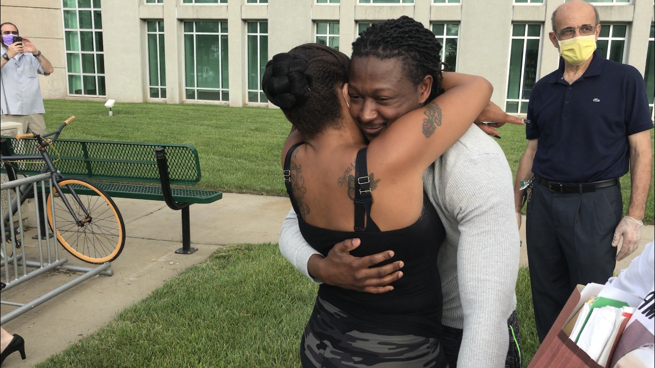 Rontarus Washington hugging supporter