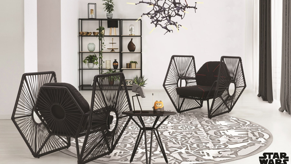 The Darth Vader armchair is artfully shaped like the Sith Lord's mask and features a foldable swivel table and an open weave canopy, to scheme against the Rebel Alliance in full comfort.
