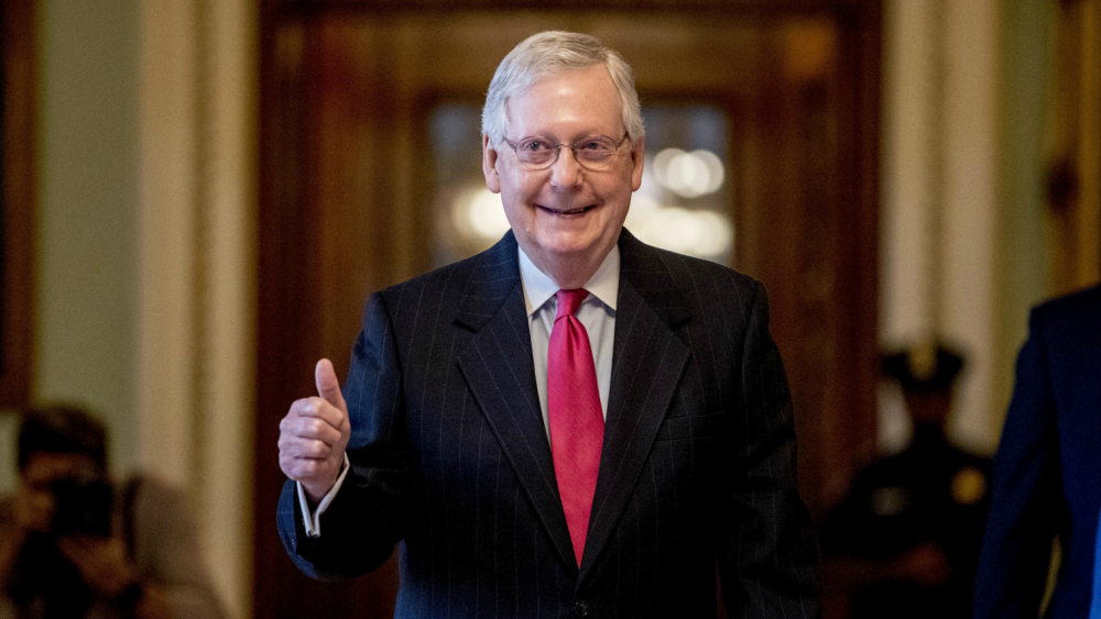 Mitch McConnell gives a thumbs up