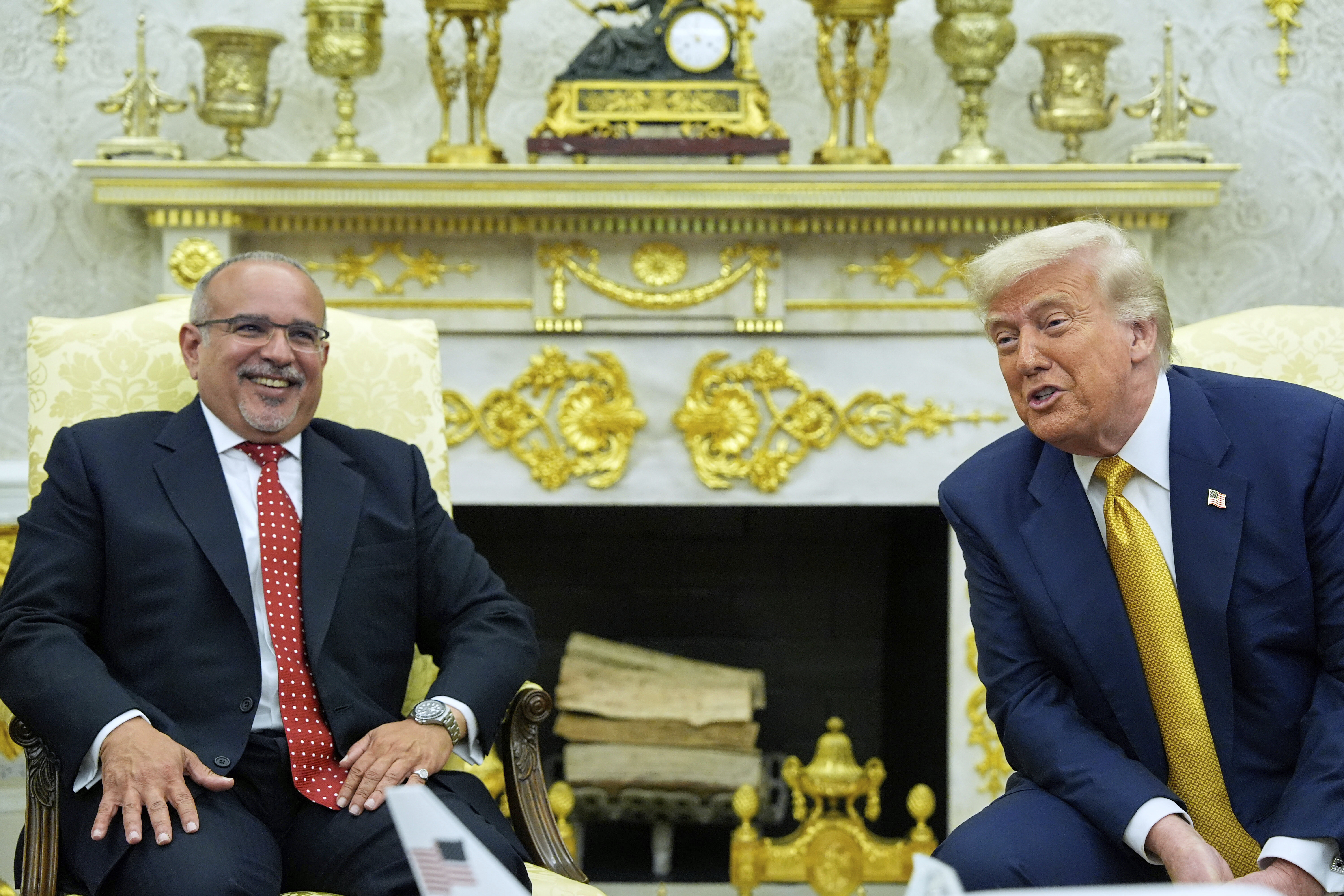President Donald Trump and Bahrain's Crown Prince Salman bin Hamad Al Khalifa speak in the Oval Office of the White House, Wednesday, July 16, 2025, in Washington. 