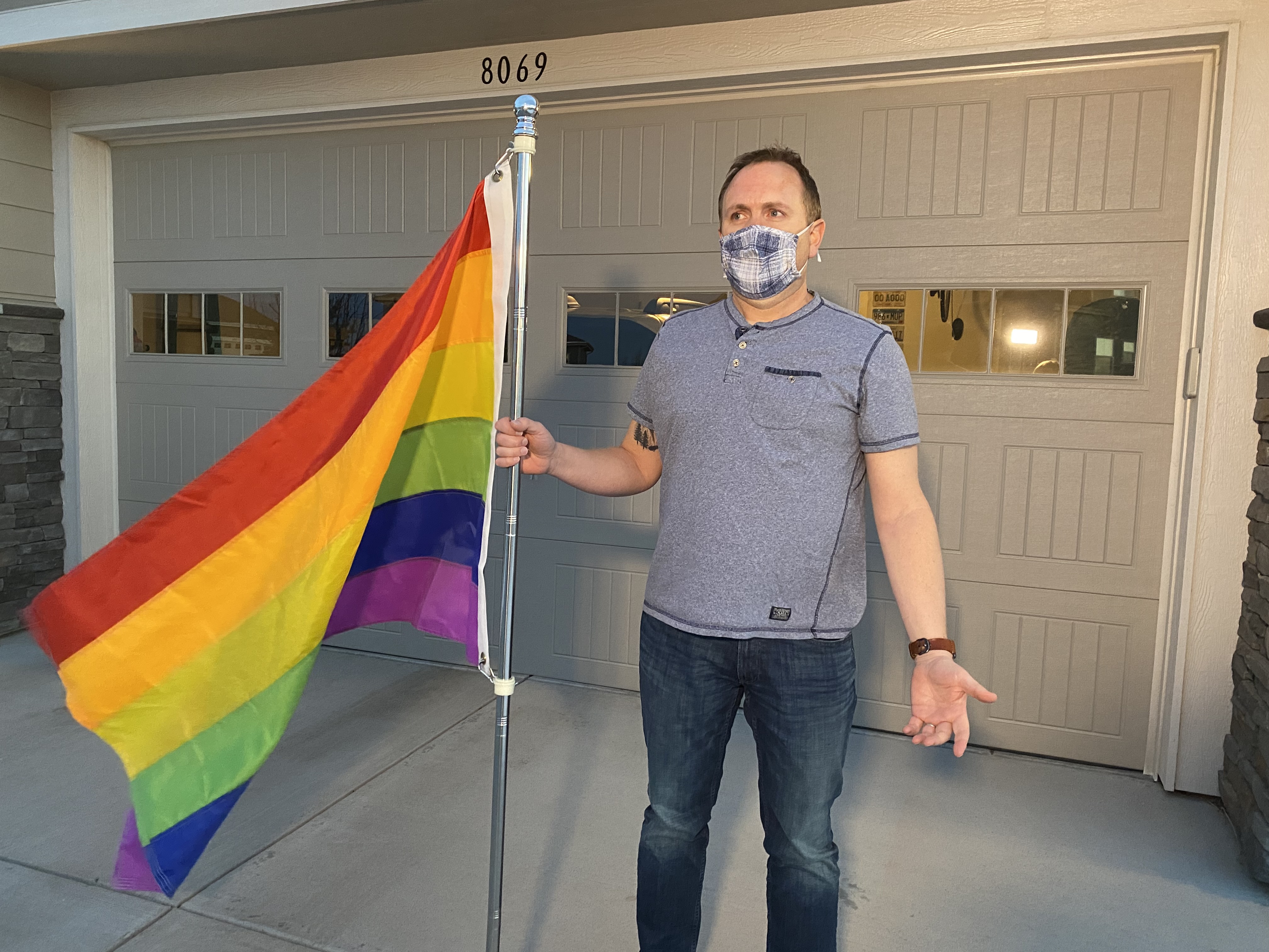 Arapahoe County man with his pride flag he was told to take down