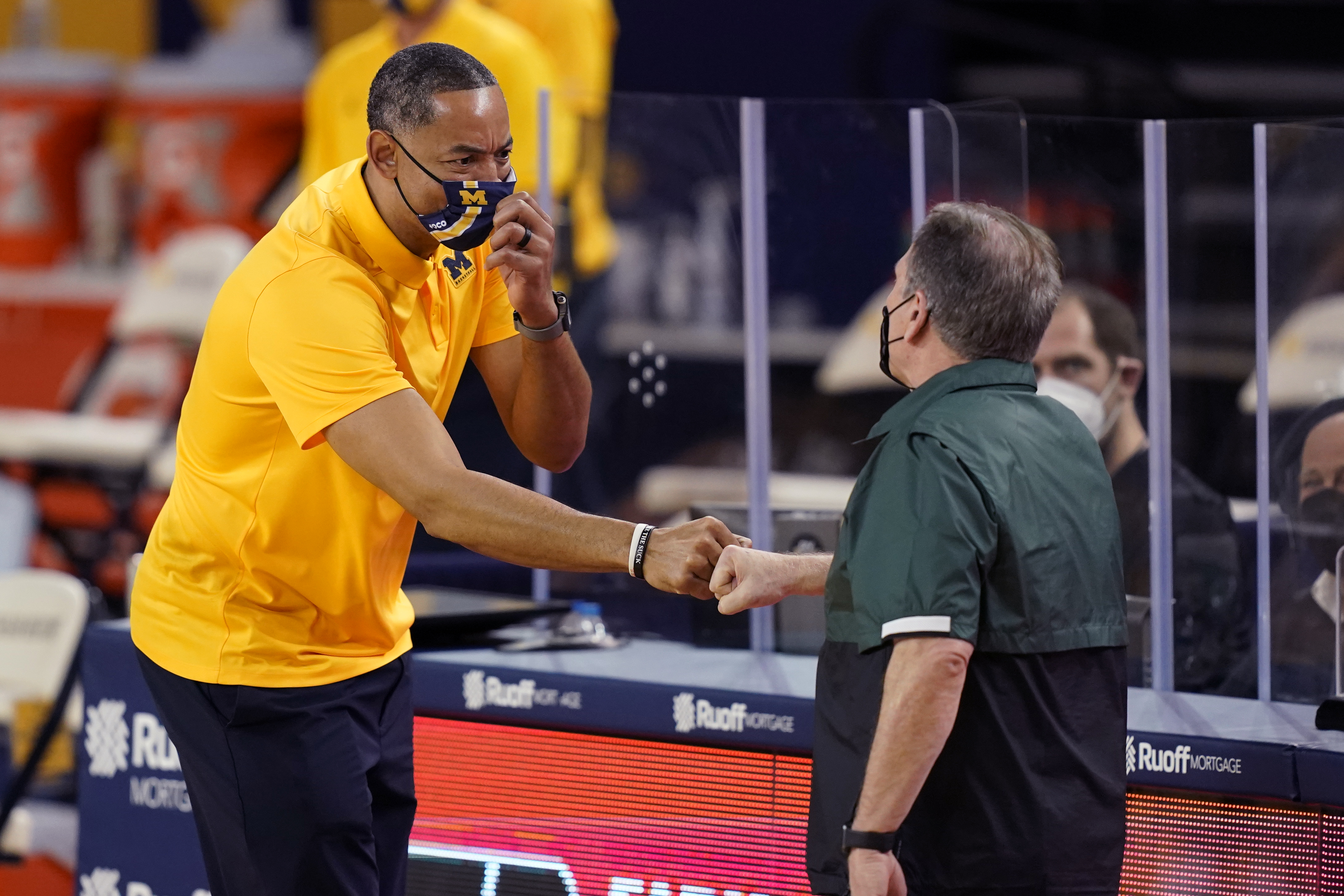 FILE Juwan Howard, Tom Izzo