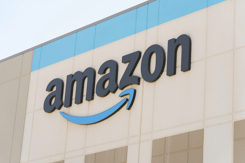 The Amazon logo is seen on the exterior wall of the Amazon OXR1 fulfillment center.