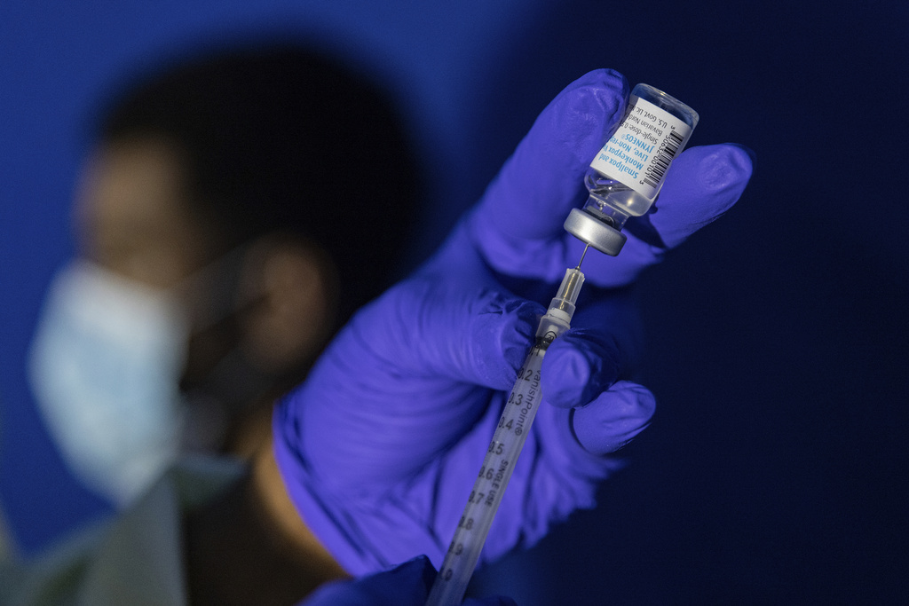 Family nurse practitioner Carol Ramsubhag-Carela prepares a syringe with the Mpox vaccine before inoculating a patient at a vaccinations site on Aug. 30, 2022, in the Brooklyn borough of New York. 