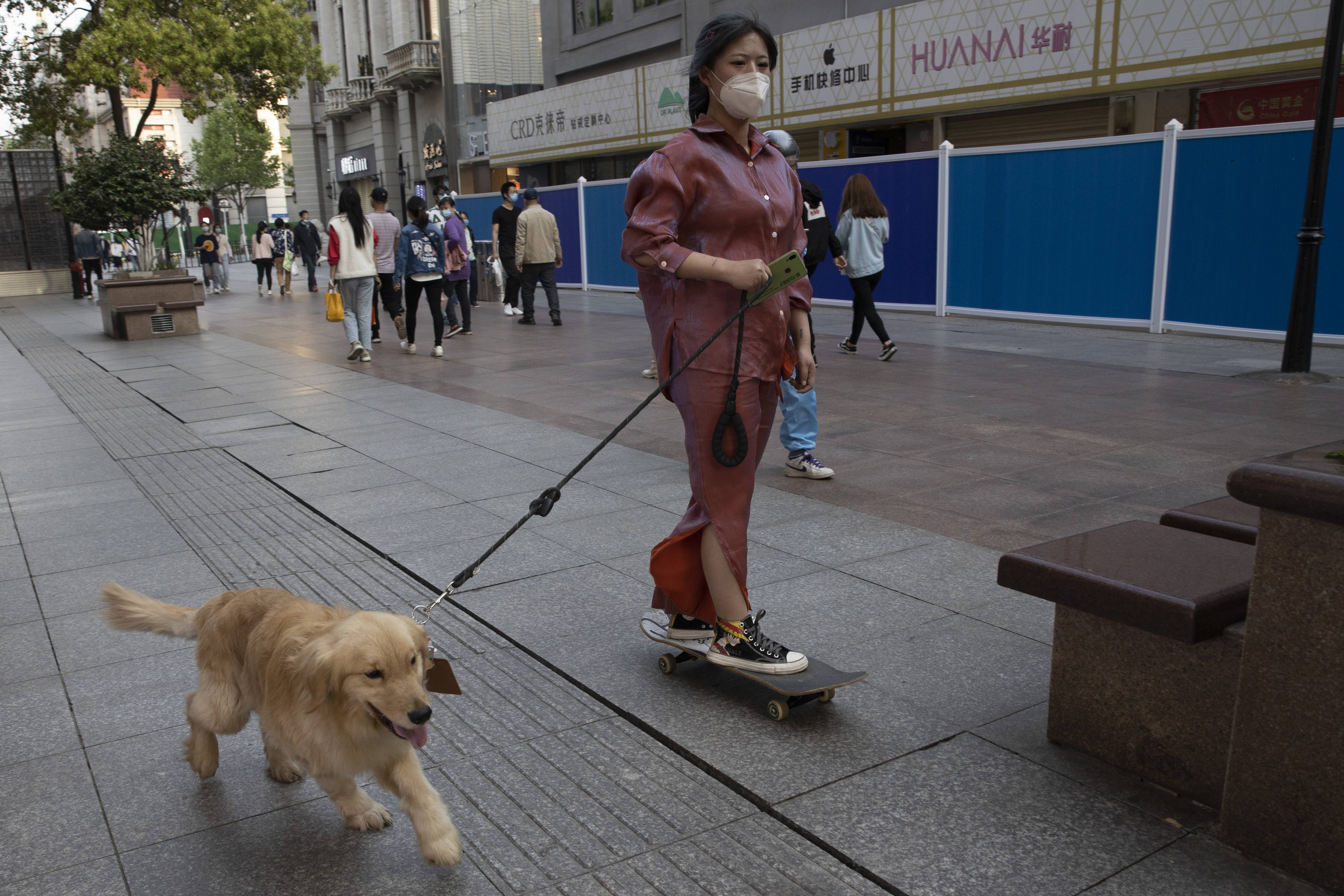 Virus-hit Wuhan cautiously revives amid thicket of controls