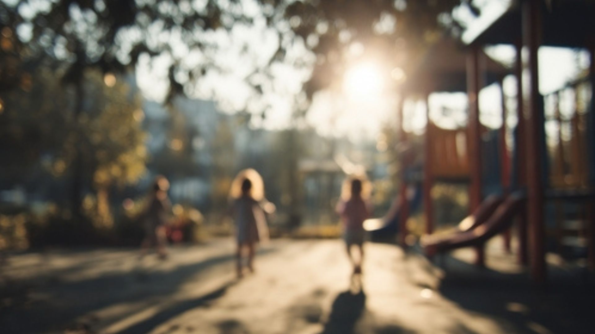Blurred image of kids on a playground.