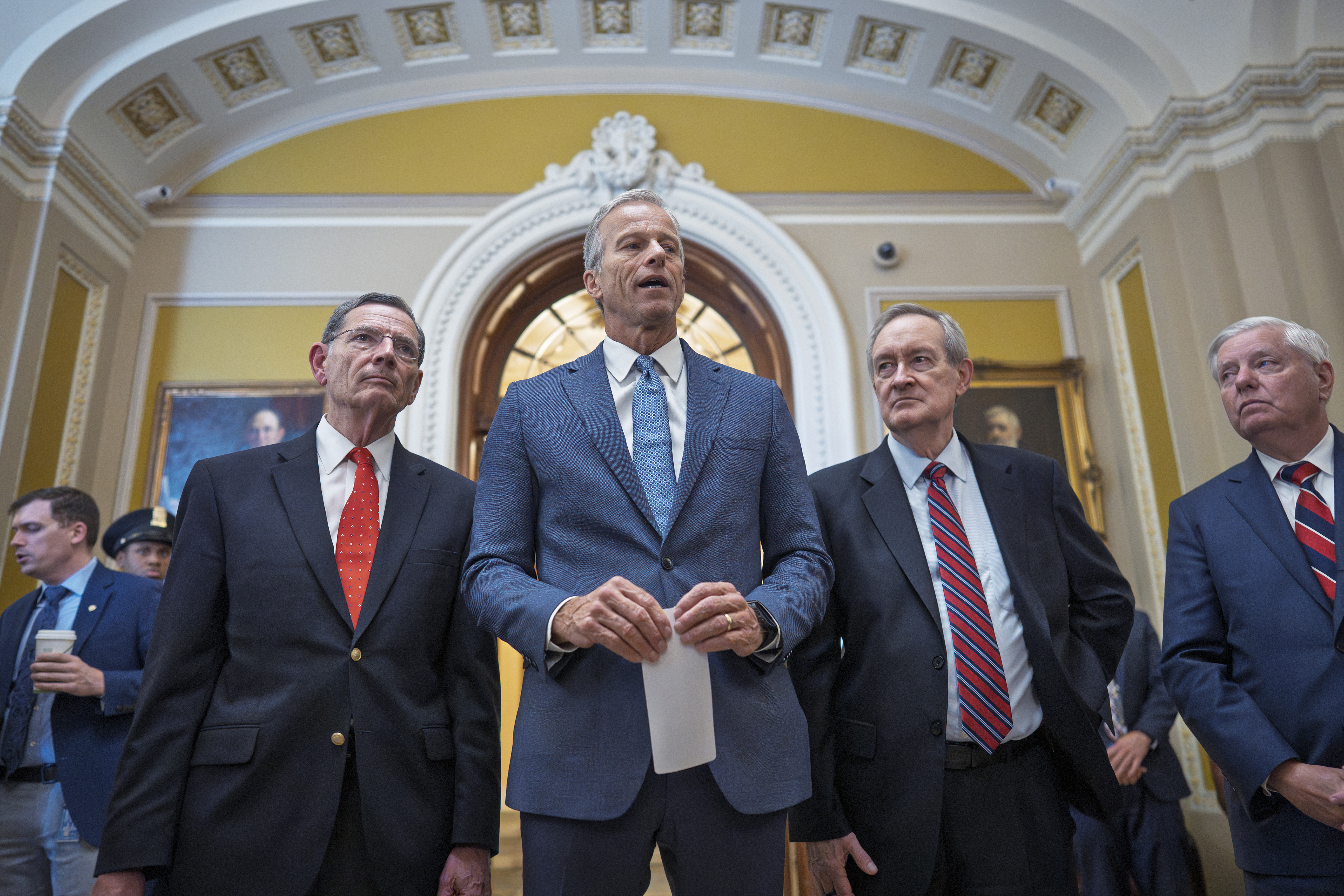 Senate Majority Leader John Thune, R-S.D., center, joined from left by, Sen. John Barrasso, R-Wyo., the GOP whip, Finance Committee Chairman Mike Crapo, R-Idaho, and Budget Committee Chairman Lindsey Graham, R-S.C
