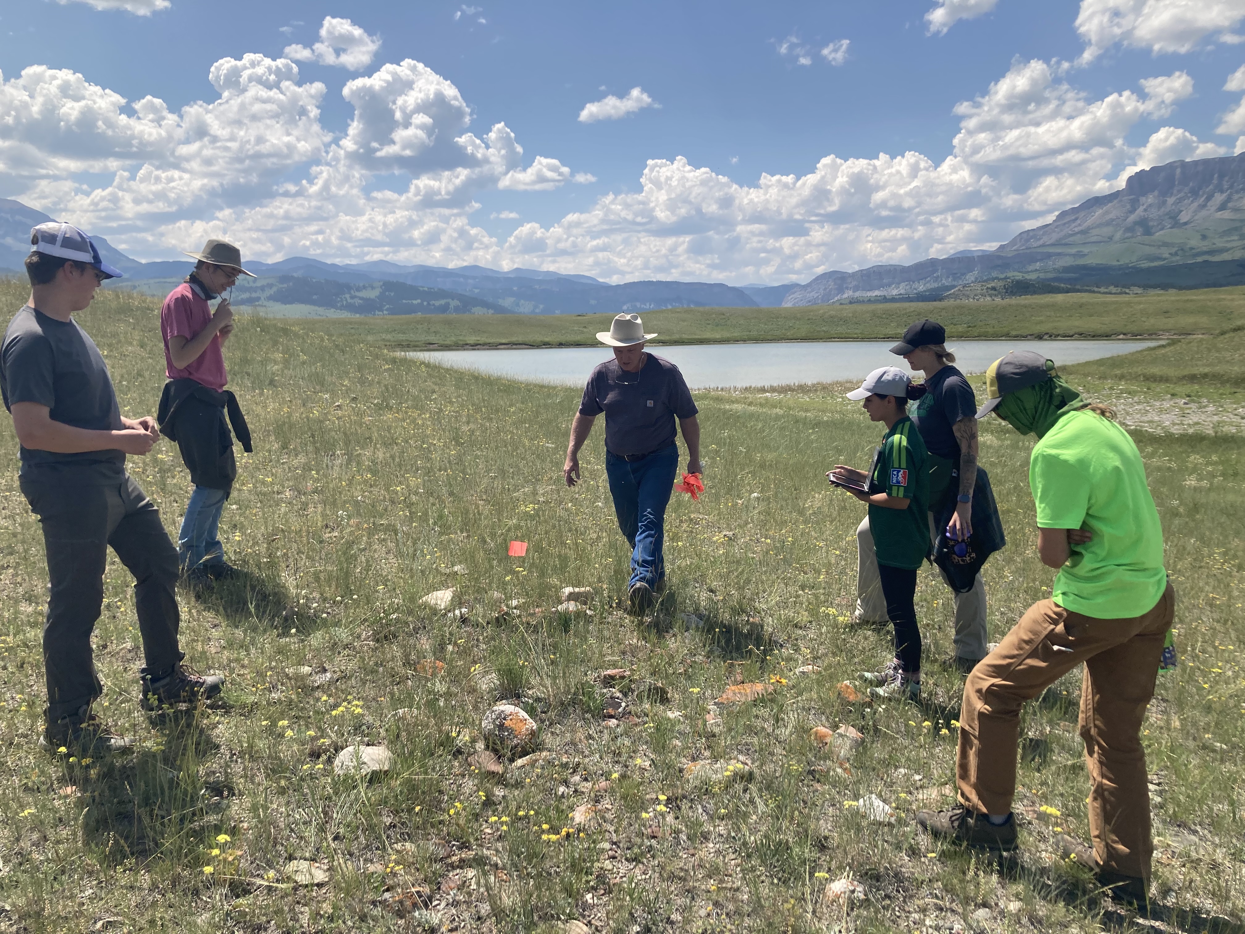 Students observe stone circle 