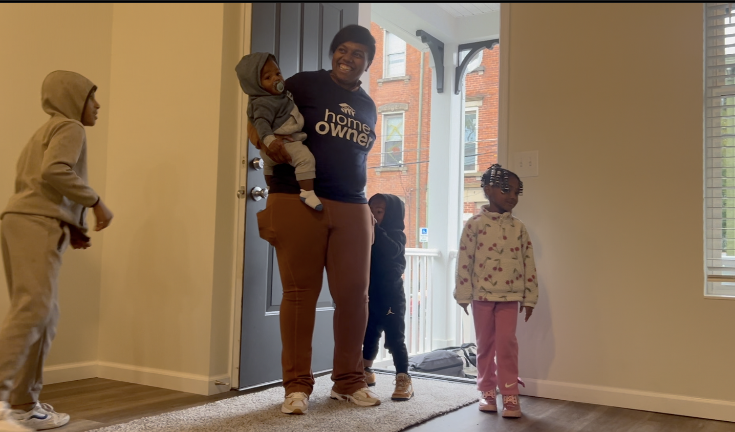 Taleah and children walk into finished home 