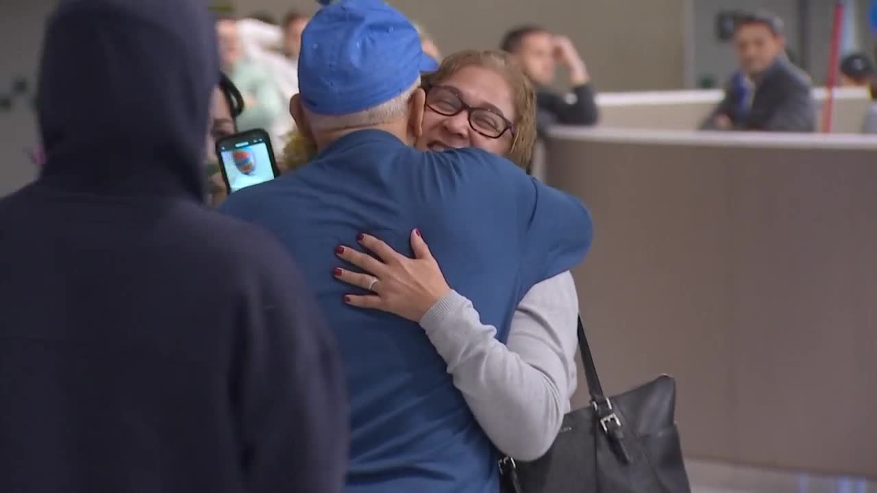 American evacuees hug family members after returning home from Israel