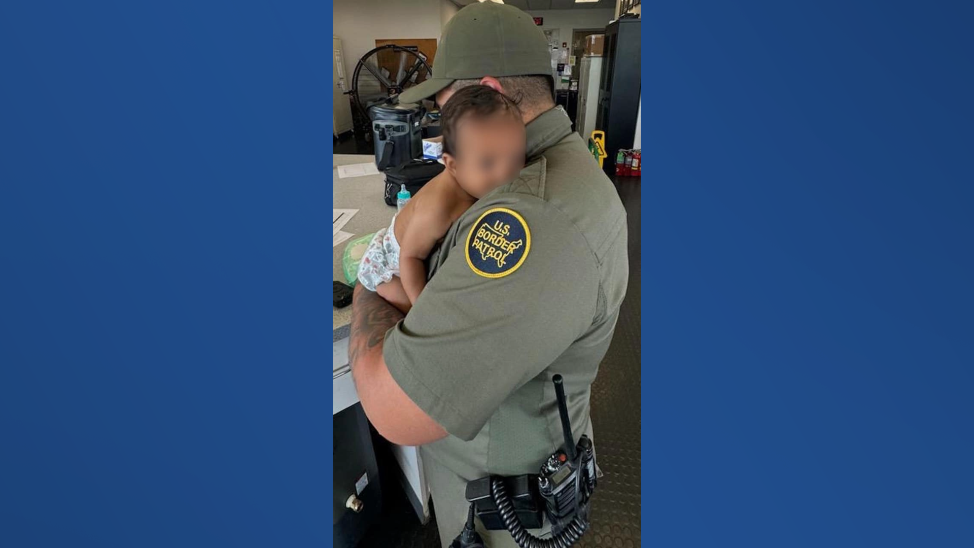 Missing kid held by border patrol agent.png